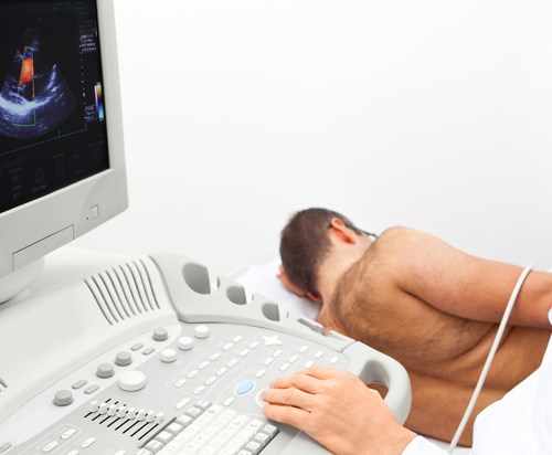 A patient undergoing a carotid ultrasound procedure and echocardiogram procedure.